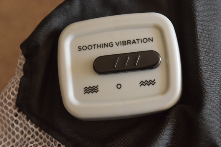 Vibrating travel outlet cot